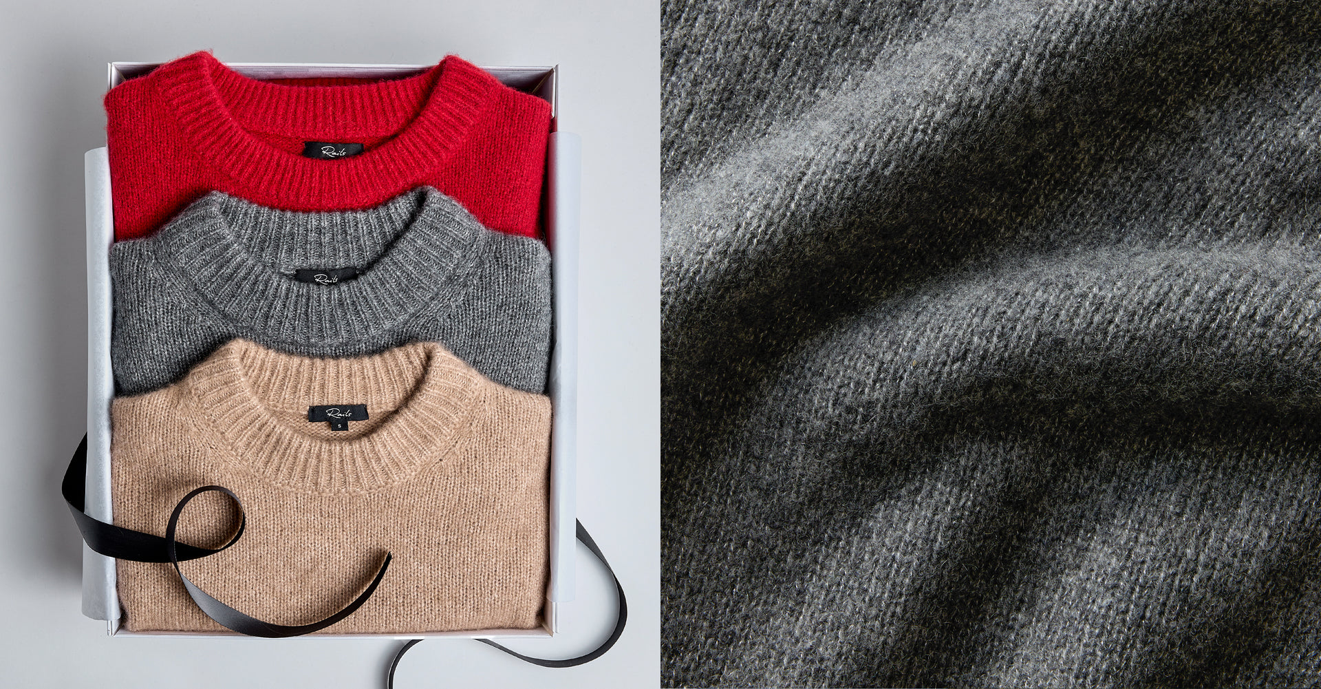 EDITORIAL IMAGE OF MULTIPLE CASHMERE SWEATERS FOLDED IN A GIFT BOX TOGETHER