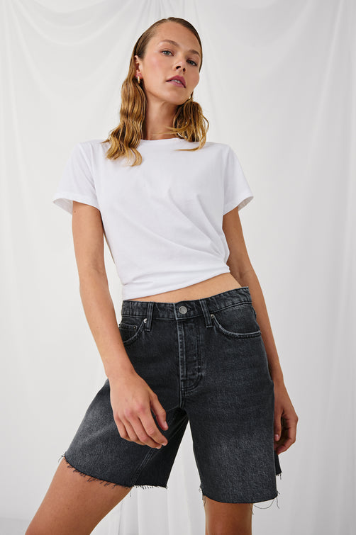 Beachwood high rise bermuda length denim short in dark wash Black Smoke - stylized front view on model