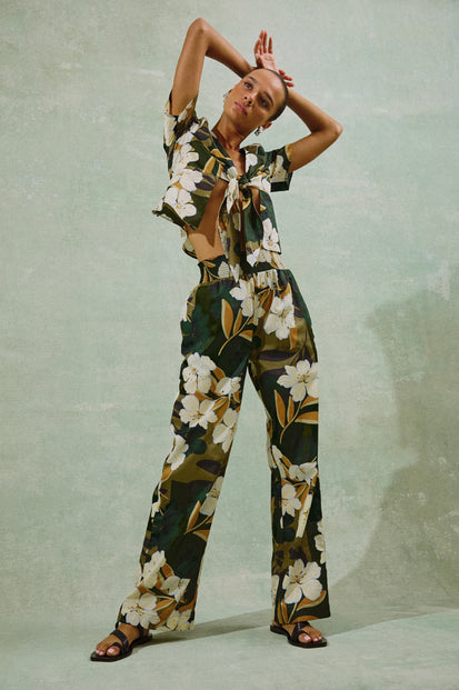 Brendon full length Pant in Plumerias tropical floral print with elastic waistband - front view on model, full body with pose