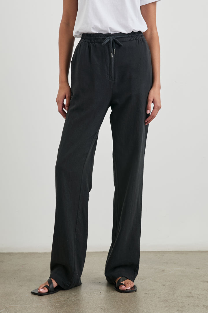 Brooklyn Pants with a Drawcord Elastic Waist, Two Front Pockets and Two Back Welt Pockets in Washed Black Colorway - Front View Featured on Model