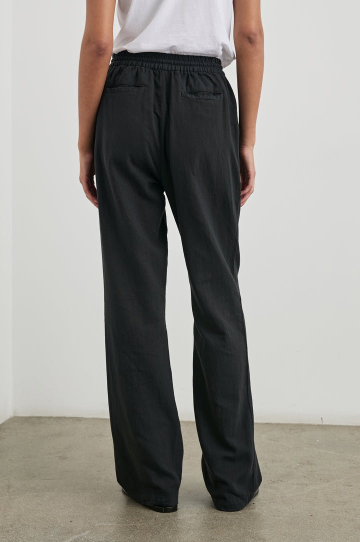 Brooklyn Pants with a Drawcord Elastic Waist, Two Front Pockets and Two Back Welt Pockets in Washed Black Colorway - Front View Featured on Model