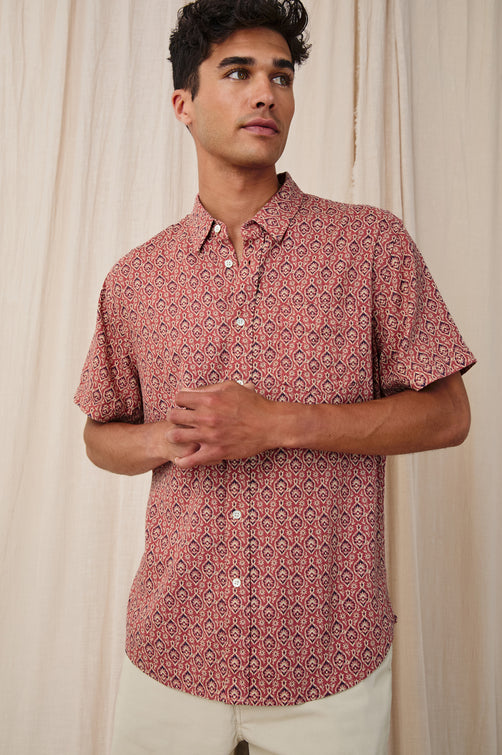 Carson linen short sleeve button down with a collar and ornamental pattern in Batik Rose - stylized front view on model