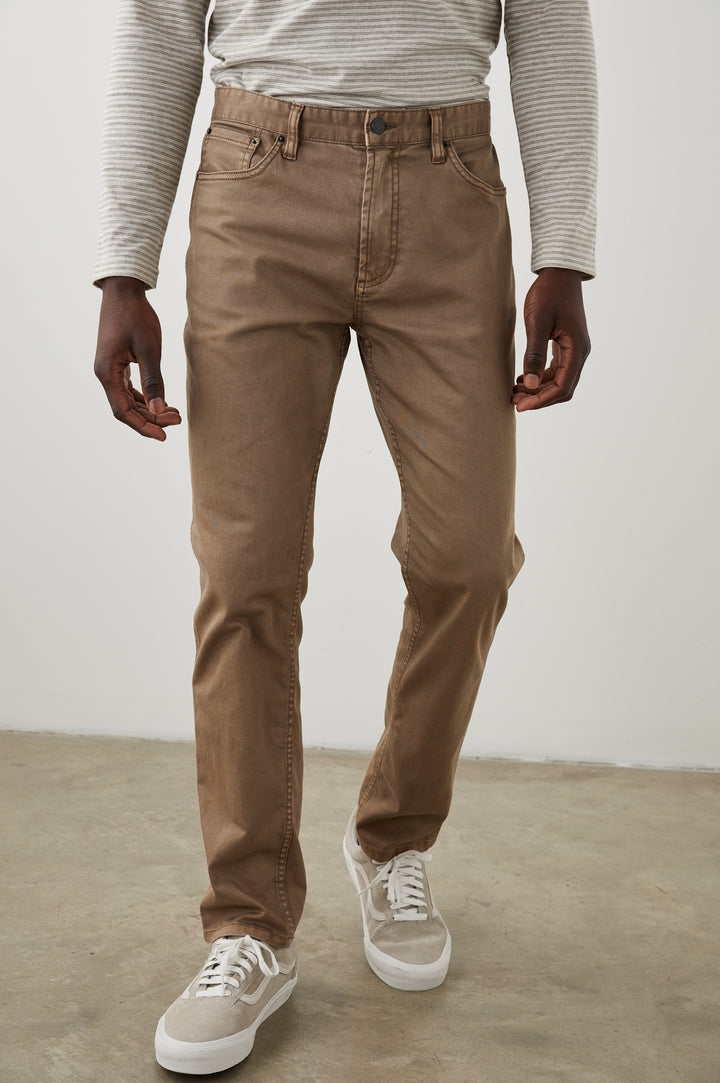 Carver Pants with Belt Loops, Two Front Pockets plus a Coin Pocket and Two Back Patch Pockets in Cacao Colorway - Front View Featured on Model