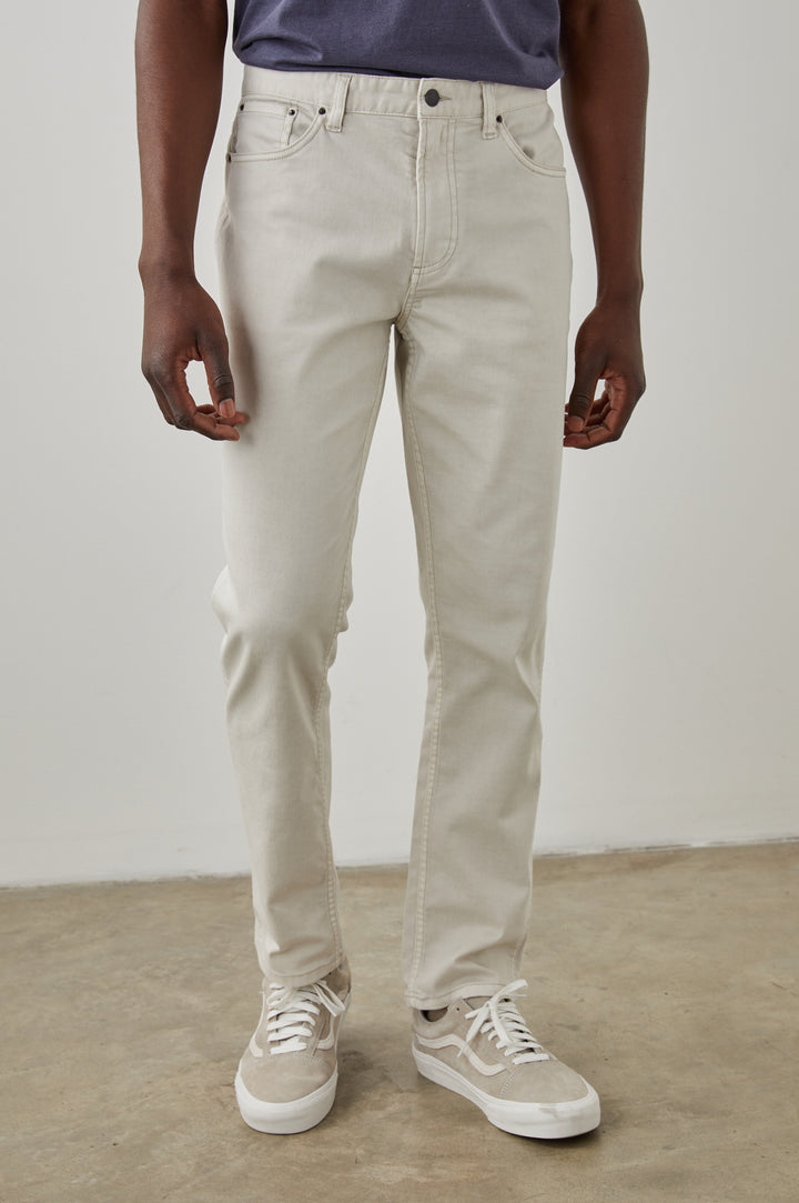 Carver Pants with Belt Loops, Two Front Pockets plus a Coin Pocket and Two Back Patch Pockets in Stone Colorway - Front View Featured on Model