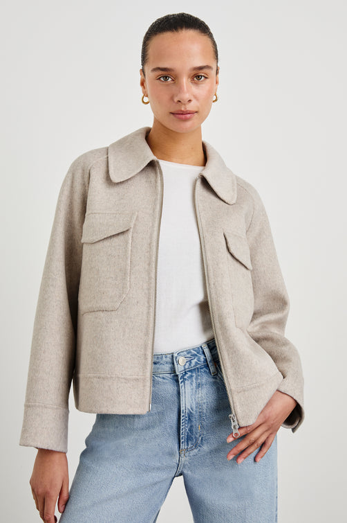 Cheyenne fitted wool jacket with oversized pockets and collar in Oatmeal - front view on model, unzipped