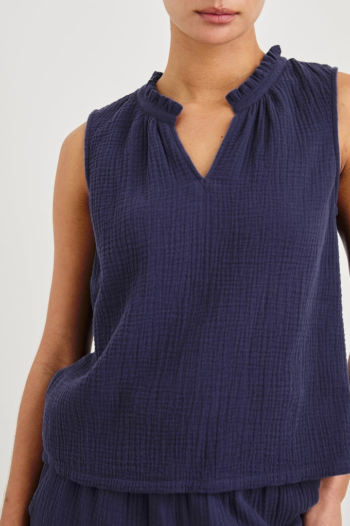 Christy Cotton Gauze Sleeveless Top with Collared V-Neck In Colorway Admiral Blue - Detail View Featured On Model