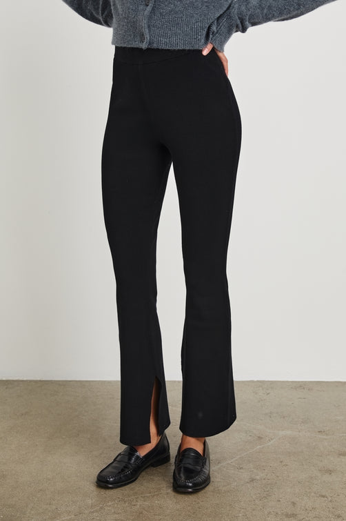 Cleo Sweatpant With A Wide Leg and Slit At Bottom Hem In Black - Front Body View Featured On Model