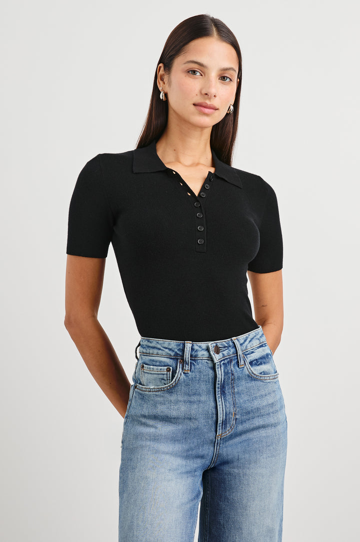 Court Polo Ribbed Knit Short Sleeve Top In Colorway Black - Front View Tucked In Featured On Model