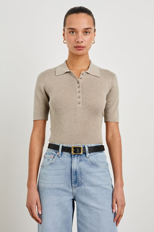 Court Polo Ribbed Knit Short Sleeve Top In Colorway Heather Oat - front view on model, tucked in with belt