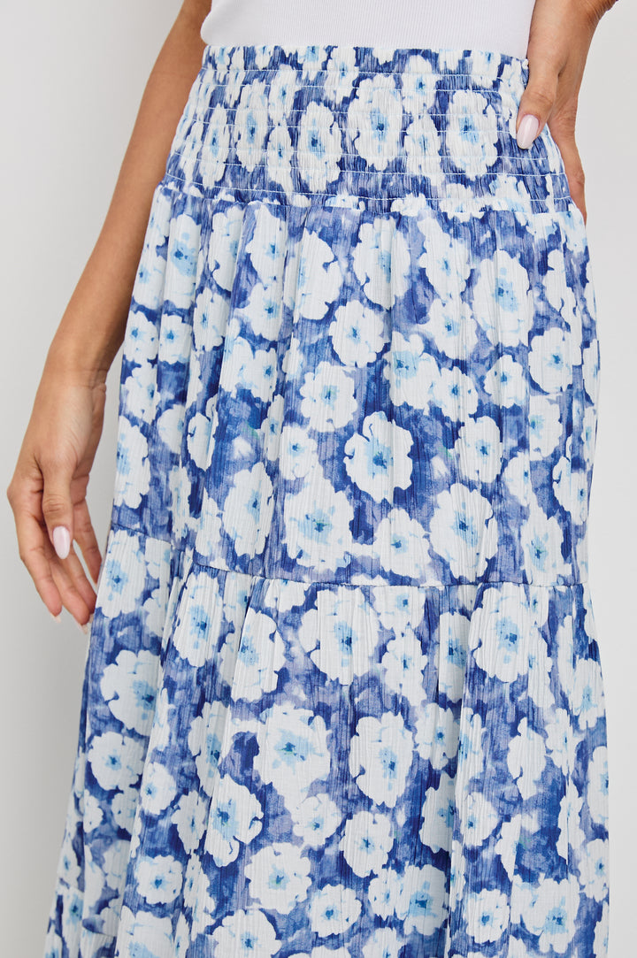 Edina Tiered Midi Skirt with Shirred High-Rise Waistline in Blue Floral Colorway, Blues and White - Front View Featured on Model