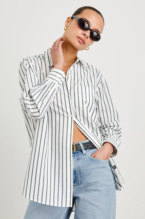 Elsa Oversized Long Sleeve Button Down Shirt With Collar And Cuffs In Chalk Slate Stripe - front view on model, partially unbuttoned with sunglasses