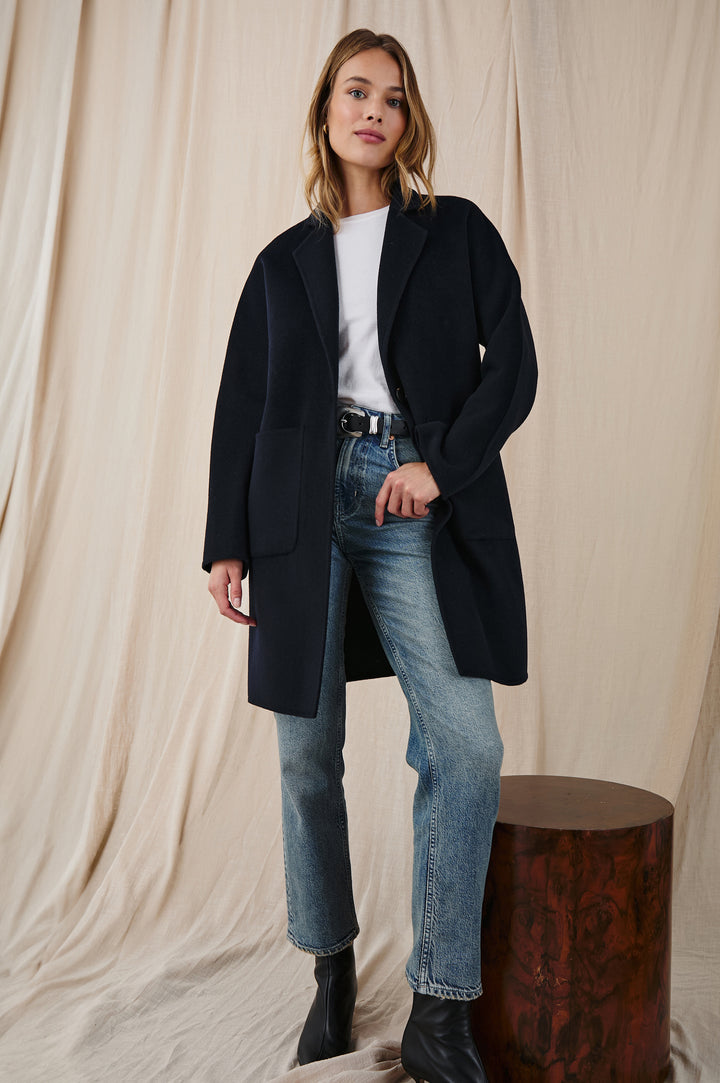 Everest Mid-Thigh Length Coat with Single Button Closure, Notched Lapels and Front Patch Pockets in Navy Colorway - Front Full Body View Featured on Model