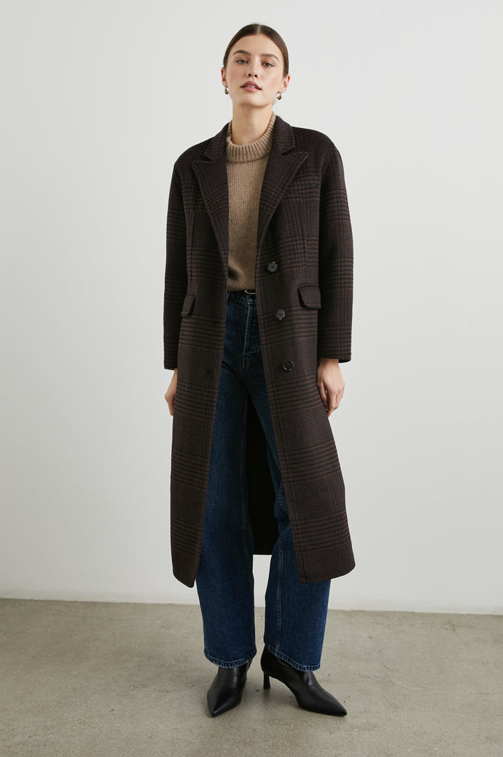 Gallery Below-the-Knee Coat with Three-Button Closure, Notched Lapels, and Two Front Flap Pockets in Espresso Houndstooth Colorway - Front Full Body View Featured on Model