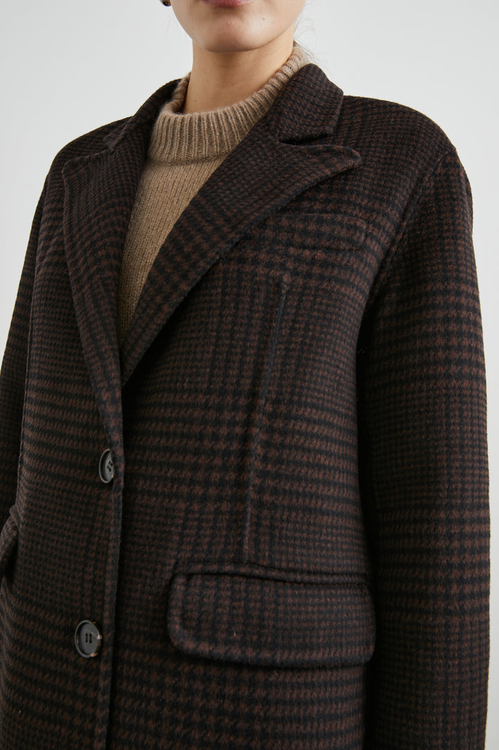 Gallery Below-the-Knee Coat with Three-Button Closure, Notched Lapels, and Two Front Flap Pockets in Espresso Houndstooth Colorway - Front View Featured on Model