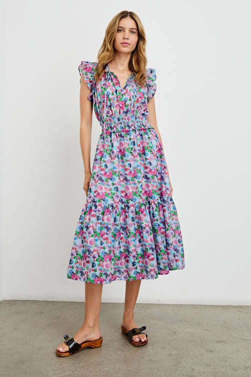 Garden Midi Dress with Flutter Cap Sleeves, Drawstrings at Neck and Shirred Waistband in Spring Meadow Colorway, Flowers in Pinks, Blues and Green - Front Full Body View Featured on Model