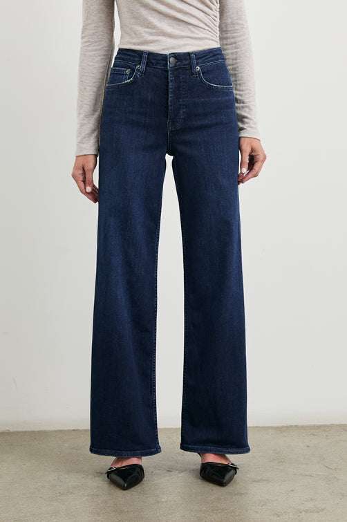 Getty Wide Leg Denim Pants with Belt Loops, Two Front Pockets and Two Back Patch Pockets in After Midnight Colorway - Front View Featured on Model