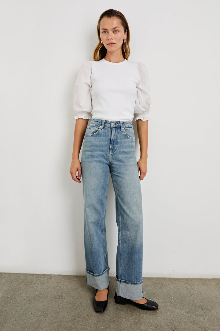 Getty Wide Leg Denim Pants with Cuffed Hems, Belt Loops, Two Front Pockets and Two Back Patch Pockets in Baltic Sea Cuffed Colorway - Front Full Body View Featured on Model