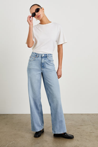 Getty high waisted 5 pocket wide leg jean in light wash Jasper - full body front view on model, posing with sunglasses