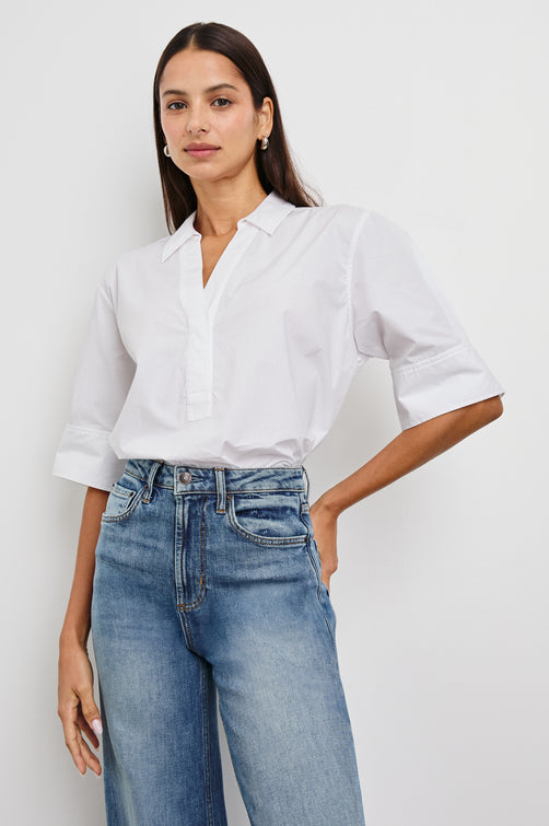 Juda 3/4 Sleeve Top With Front Placket And Collar In Colorway White - Front View Tucked In Featured On Model