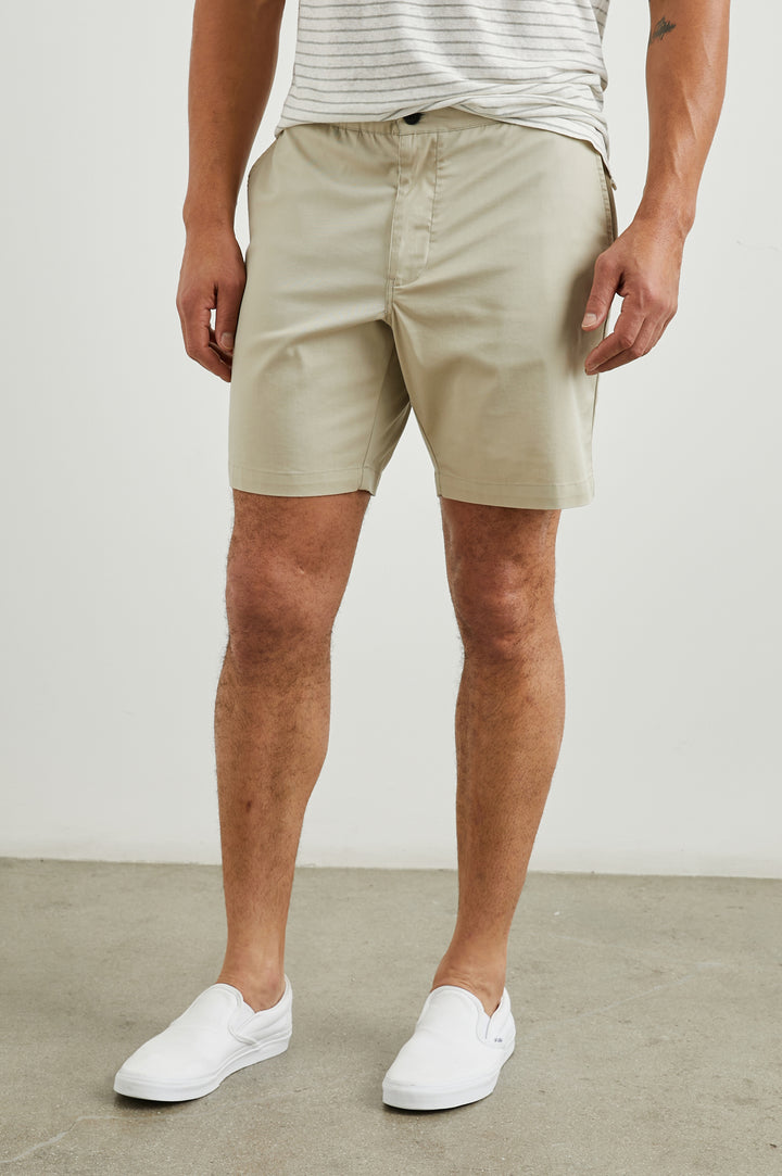 Laguna Shorts with Belt Loops, Two Front Pockets with a Zippered Key Pocket and Two Back Button Welt Pockets in Heritage Khaki Colorway - Front View Featured on Model