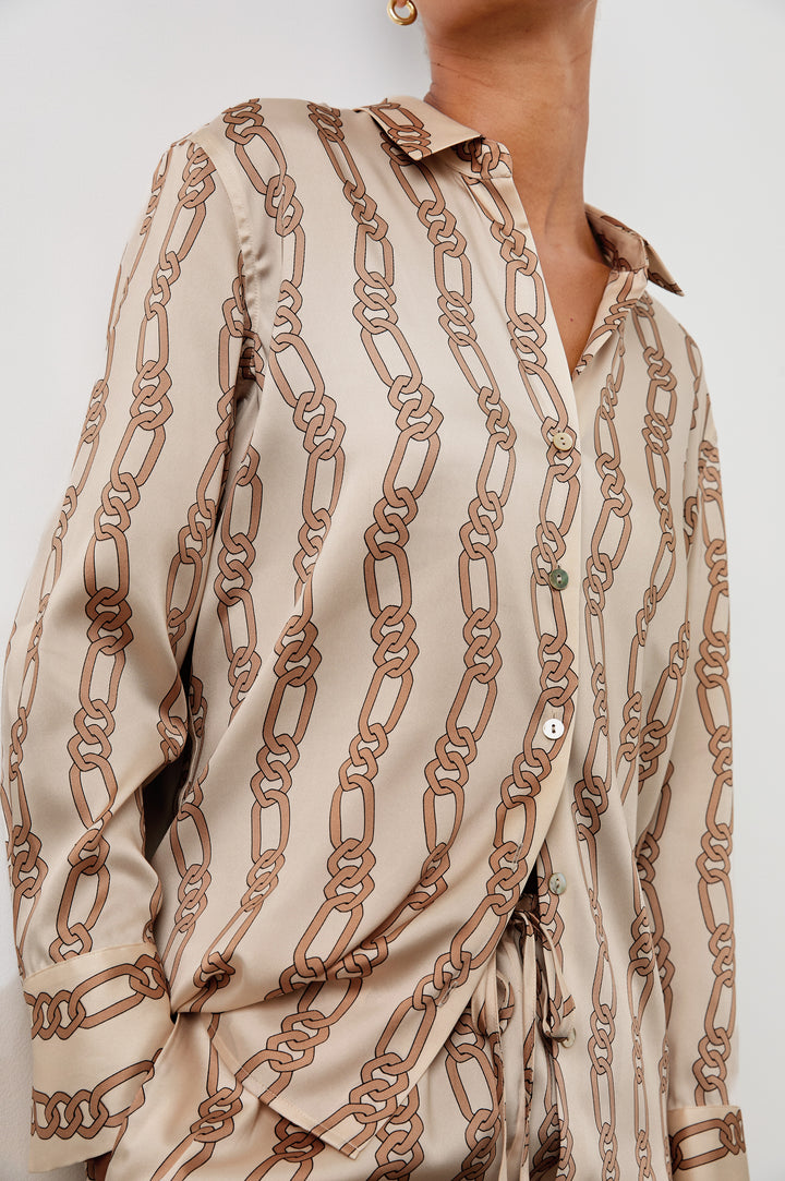 Ledger Long-Sleeve Button Down in Ivory Gold Link Colorway, vertical gold links on tan - Front View Featured on Model