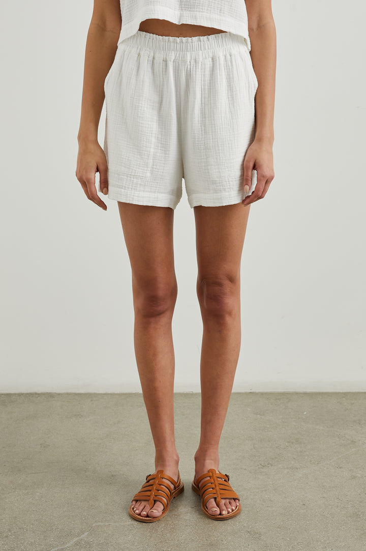 Leighton Shorts with Textured Fabric, a Smocked Elastic Waist, and Large Front Pockets in White Colorway - Front View Featured on Model