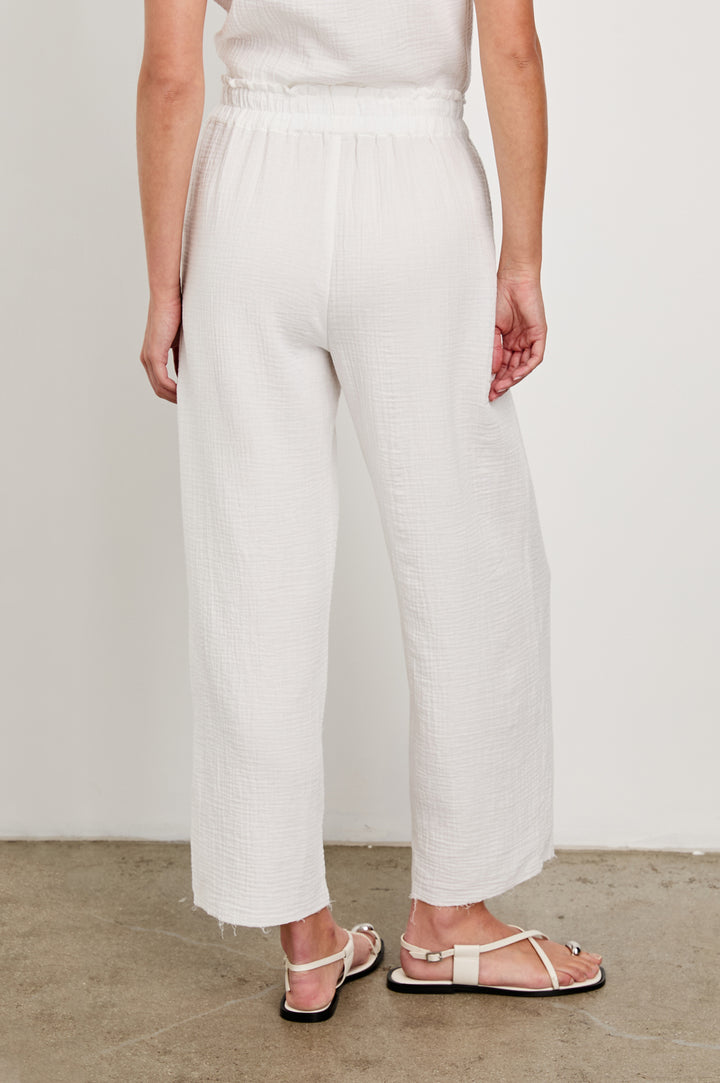 Leon Crop Cotton Gauze Pant With Hemline Slit And Elastic Waist In Colorway Taupe - Back View Featured On Model