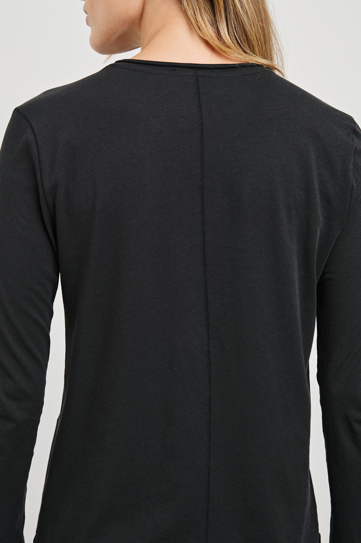 Long Sleeve Crew Neck T Shirt with Raw Hem, Collar and Cuffs in Black Colorway - Back View Featured on Model