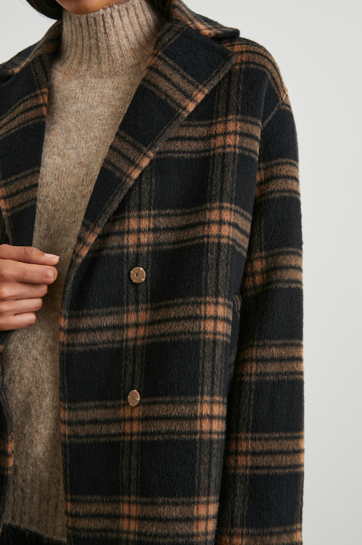 Lore Knee-Length Coat with Two Button Closure, Notched Lapels and Two Front Pockets in Camel Jet Colorway, a Plaid - Front View Featured on Model