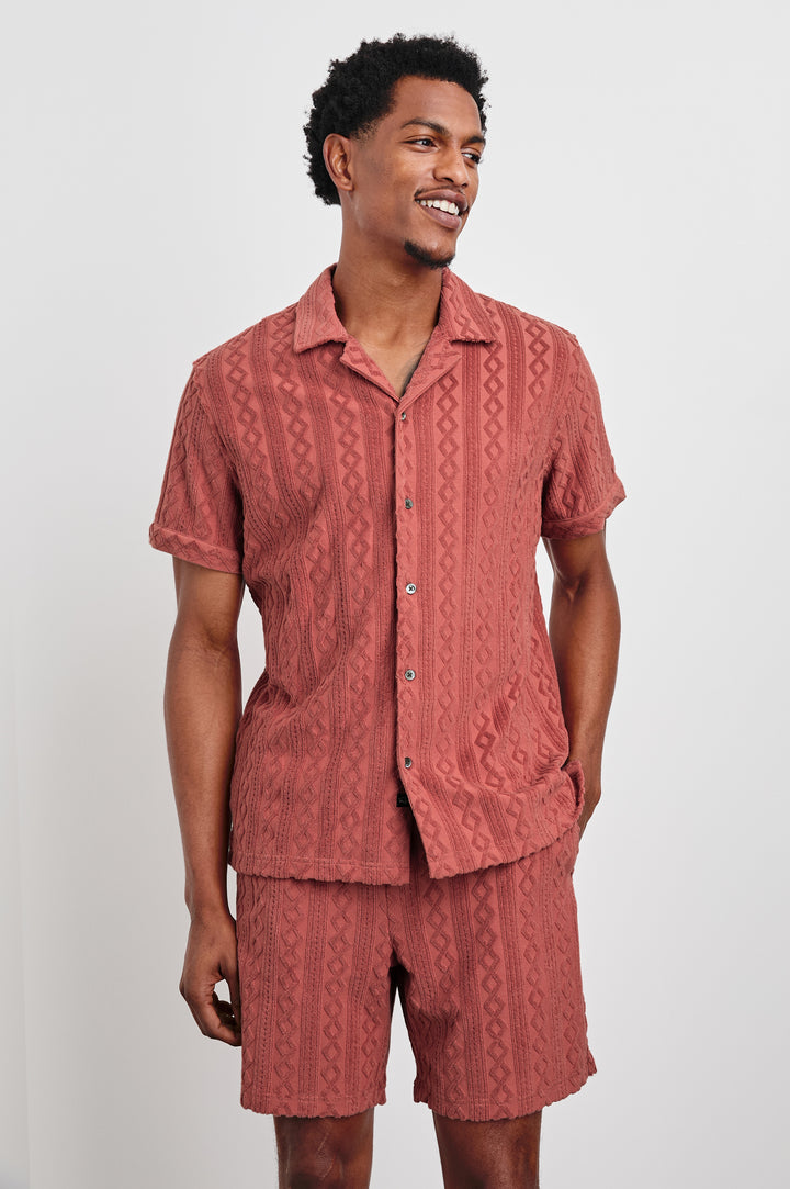 Maverick terry short sleeve with raised jacquard pattern and front buttons in Faded Red - front view on model