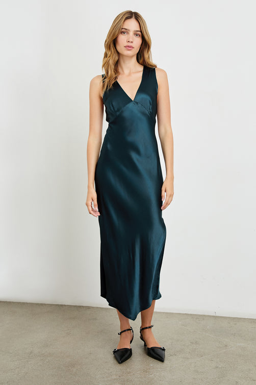 Monique Sleeveless Midi Dress with an Asymmetrical Hem Line, Side Slit, Deep V Neck, and Wide Shoulder Straps in Deep Sea Colorway - Front Full Body View Featured on Model