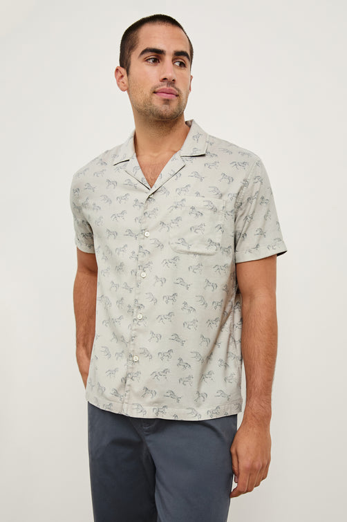 Moreno short sleeve button up shirt with camp collar and chest pocket in Stallion Parchment Indigo pattern - front view on model