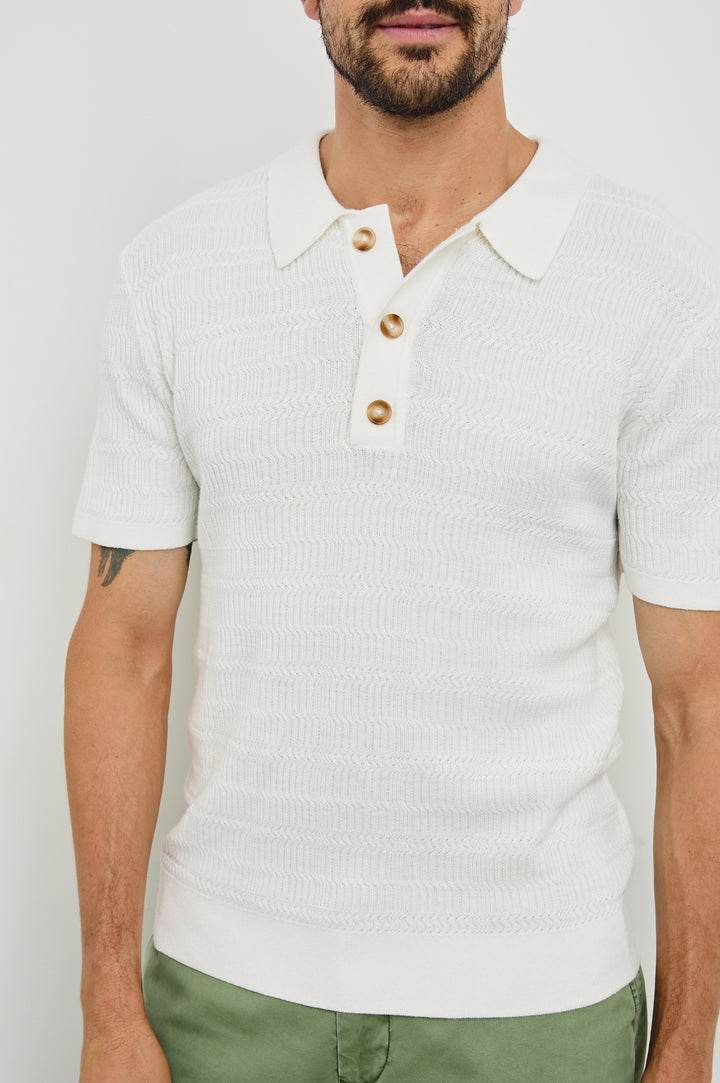 Nathan Short-Sleeve Polo Shirt with a Three-Button Placket and a Jacquard Pattern in White Colorway - Front View Featured on Model