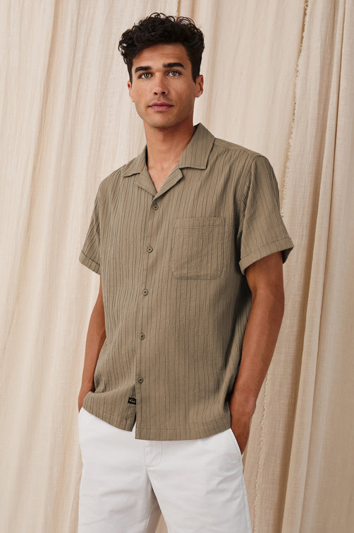 Ohana textured button up short sleeve shirt with collar and front chest pocket in Olive - front view on model