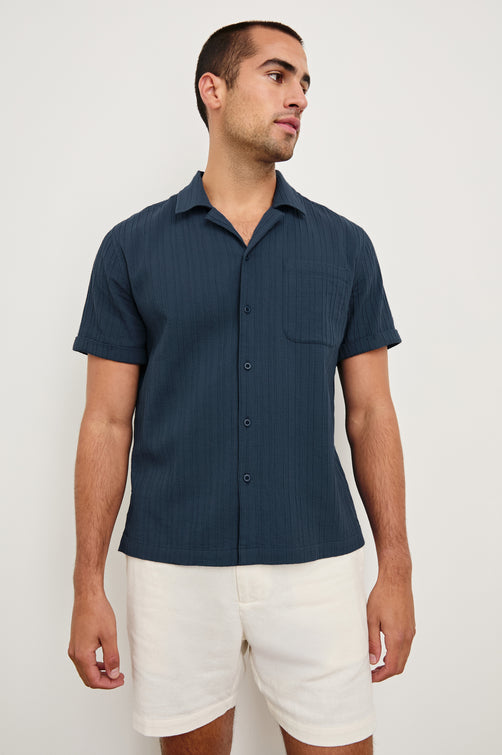 Ohana textured button up short sleeve shirt with collar and front chest pocket in Sea Blue - front view on model