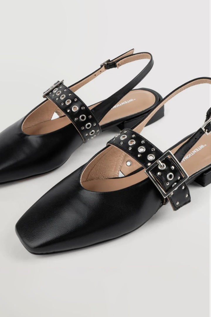 Intentionally Blank Pearl Ballet Flat with an Adjustable Slingback Strap, a Studded Upper Buckle Strap, a Small Heel and a Square Toe in Black Colorway - Overhead View 