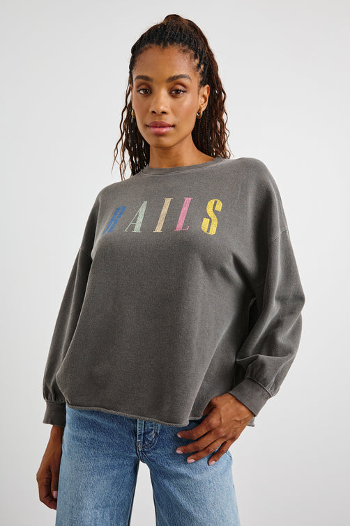 Rails Signature Long-Sleeve Sweatshirt with a Crew Neck, Raw Hem, Shirring Above Cuff, and the Text, Rails, in Vintage Black Colorway, with Multi Colored Text - Front View Featured on Model 