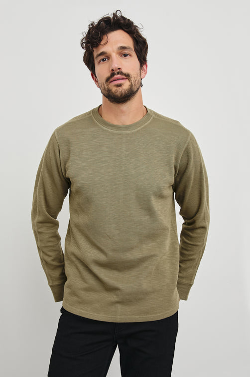 Rheese Long-Sleeve Thermal with Crew Neck and Statement Seams on Sleeves and Back in Green Olive Colorway - Front View Featured on Model