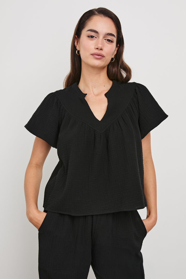 Sayer Short Sleeve Cotton Gauze Top With V-Neck In Colorway Black - Front View Featured On Model