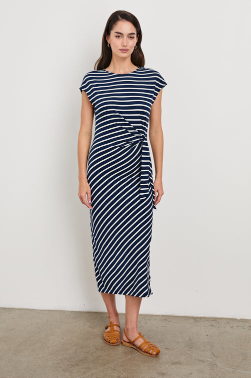 Selah Short Sleeve Jersey Dress With Side Tie In Colorway Navy Ivory Stripe - Front View Featured On Model