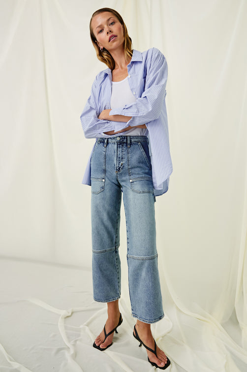 Silverado high rise wide leg crop pant with carpenter style details and contrast stitching in Blueprint - stylized full body front view on model with arms crossed