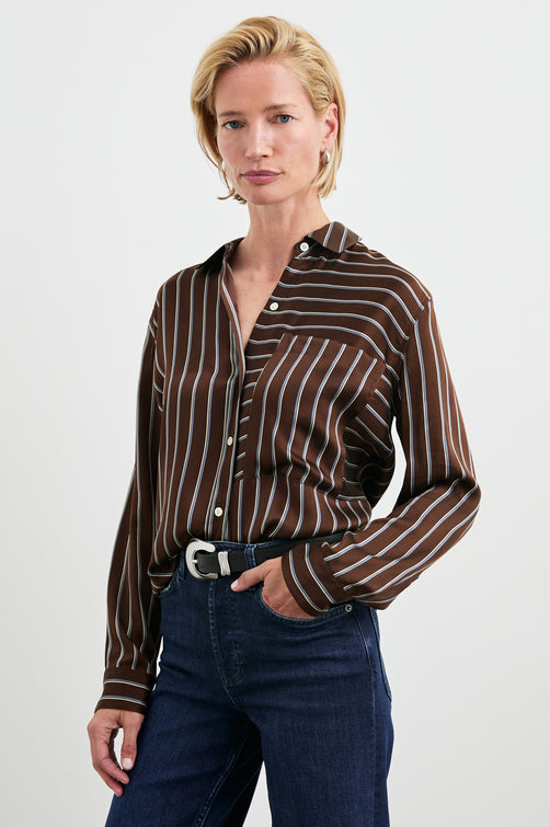 Spencer Long-Sleeve Button Up with Chest Patch Pocket in Baltic White Stripe Colorway, Thin Blue and white mixed vertical and horizontal stripes on Brown - Front Tucked View Featured on Model