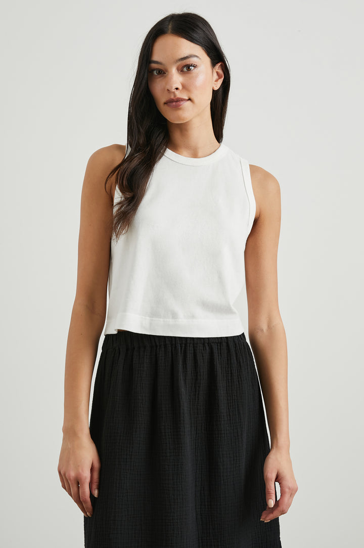 The Boxy Cropped Tank with a Crew Neck in White Colorway - Front View Featured on Model