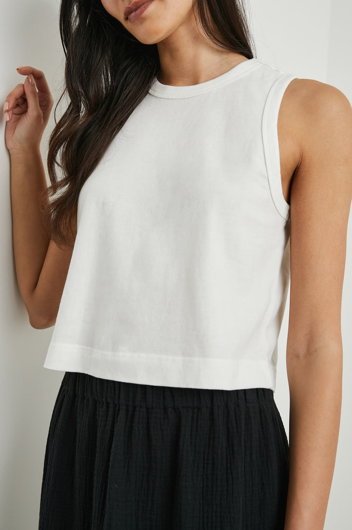 The Boxy Cropped Tank with a Crew Neck in White Colorway - Front View Featured on Model