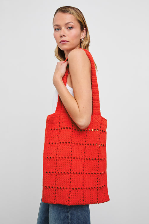 Crochet Rectangular Tote with Patchwork Grid Drop stiches in Cherry Colorway  - Side View Featured on Model