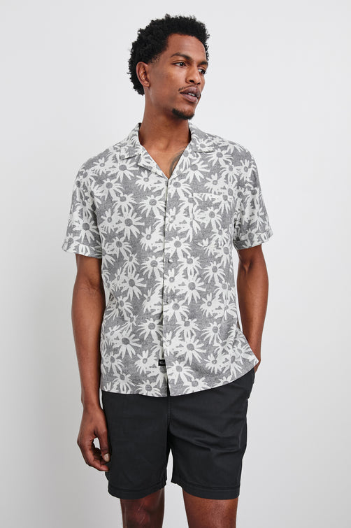 Waimea short sleeve button down shirt with camp collar and floral pattern details in Perennial Charcoal White - front view on model