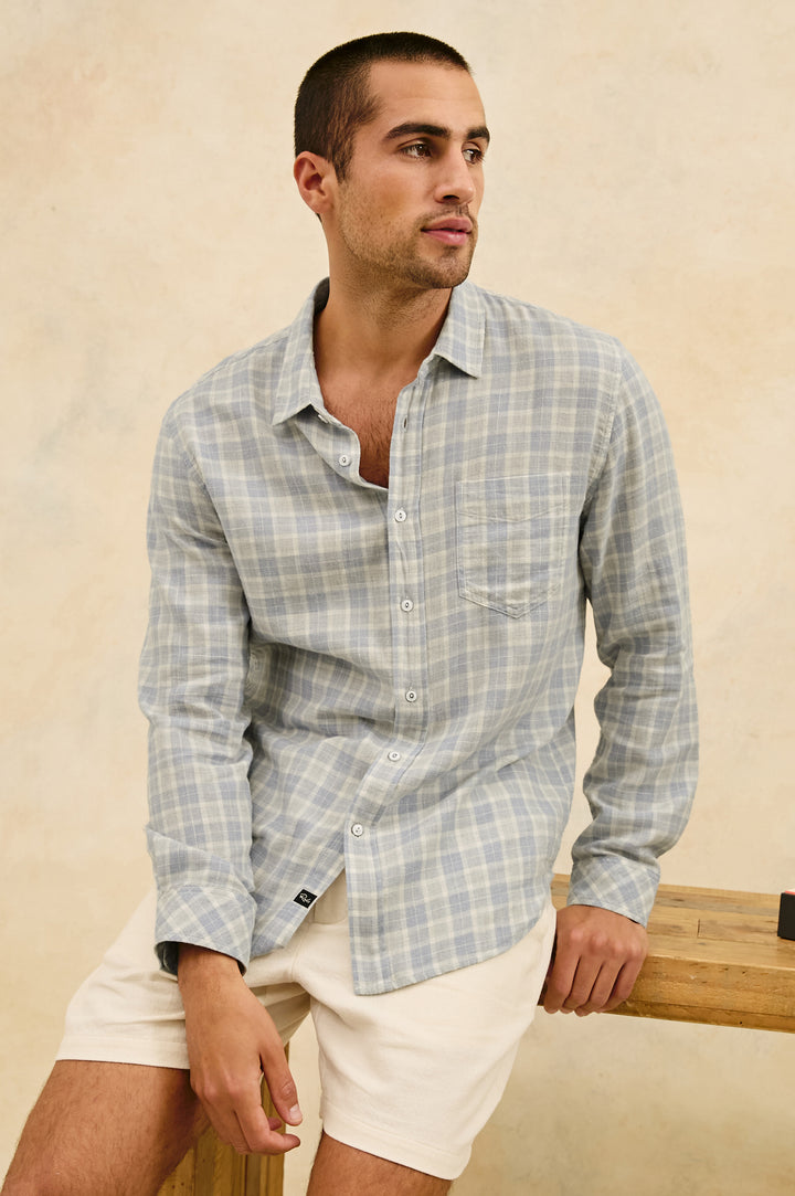 Wyatt Classic Button Up Long Sleeve Shirt with plaid print in Gentle Shore Melange - stylized front view on model,  sitting on desk