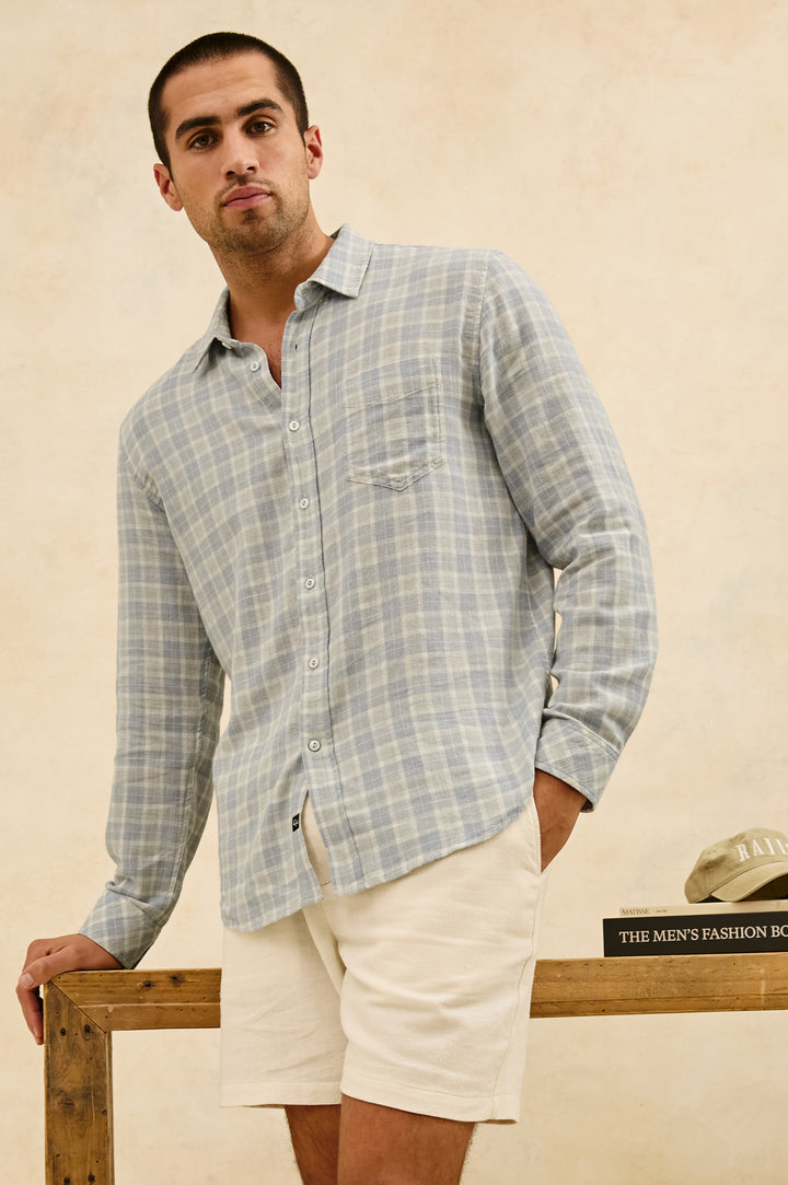 Wyatt Classic Button Up Long Sleeve Shirt with plaid print in Gentle Shore Melange - stylized front view on model, leaning on desk