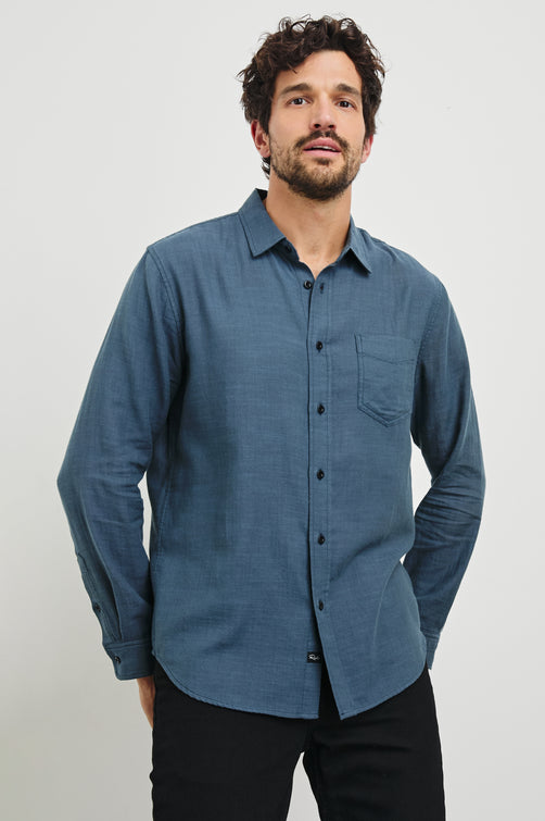 Wyatt Long-Sleeve Button Up with a Chest Patch Pocket in Sea Blue Colorway - Front View Featured on Model