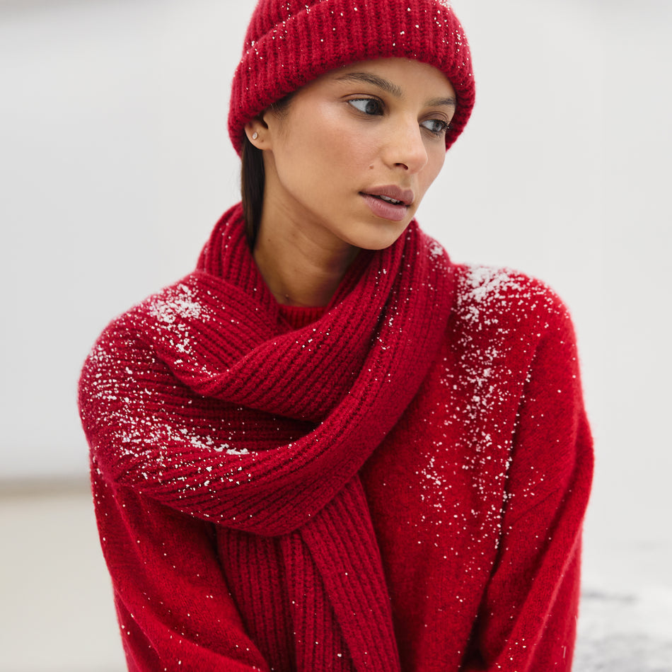 EDITORIAL IMAGE OF MODEL WEARING MIRANDA SWEATER, ALPS SCARF, AND AUTUMN BEANIE IN MERLOT